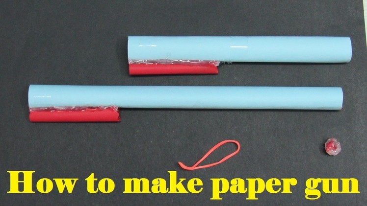 How to make a paper gun that shoots paper bullets with tape or glue