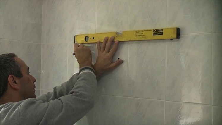 How to hang a bathroom cabinet on a tiled wall