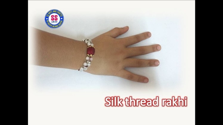 How to make silk thread rakhi for raksha bandhan.silk thread and pearls rakhi making at home