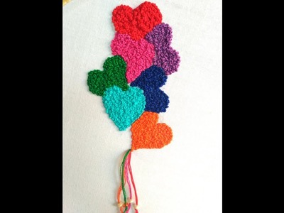Hand embroidery : French knot heart shape .