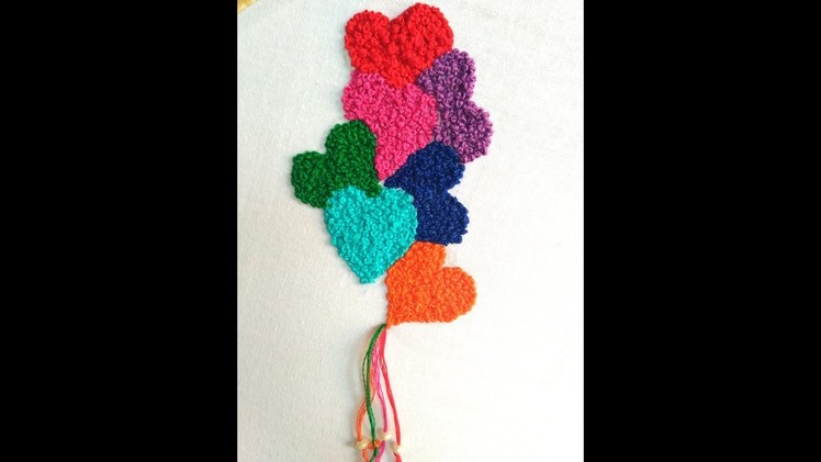 Hand embroidery : French knot heart shape .