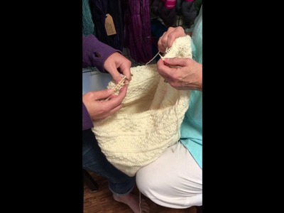 Knee To Knee. Four Handed Knitting