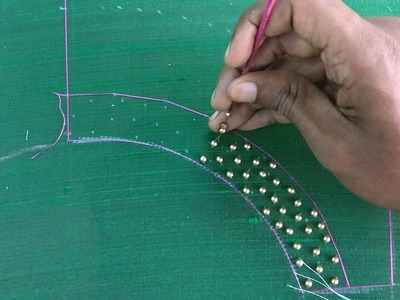 Golden bead work for a green top