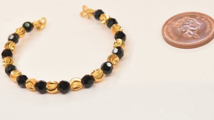 Gold Baby Bracelet with Black Beads HD