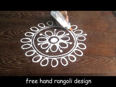 Free hand rangoli design || simple and quick flower free hand rangoli design