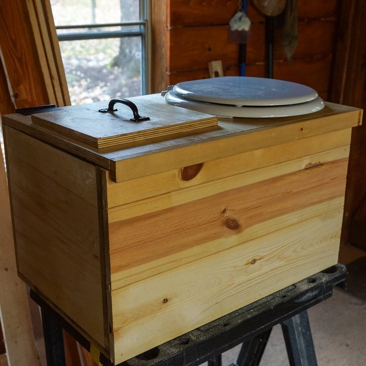 Off Grid Guest Cabin - Finishing up the sawdust toilet and installing ceiling beams