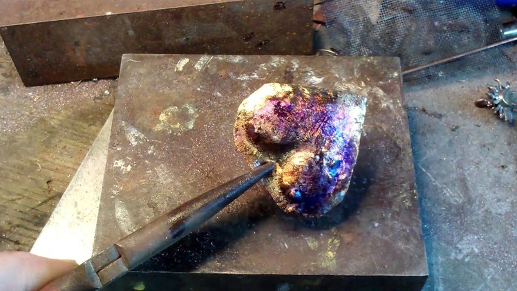 Flame coloring a hammered copper heart