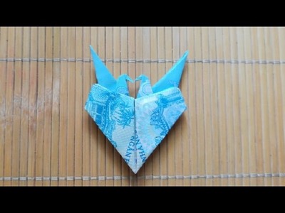 Instructed how to fold a couple of crane heart by money