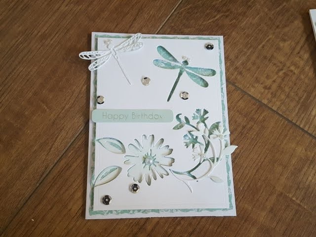 Handmade card using negative and positive space after dies cutting