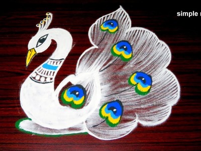 Latest peacock rangoli designs with 5x3 dots, beautiful kolam designs, creative peacock muggulu