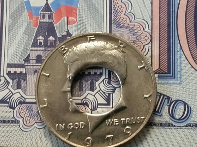Inexpensive way to get a perfectly centered punch in your coin to make a coin ring