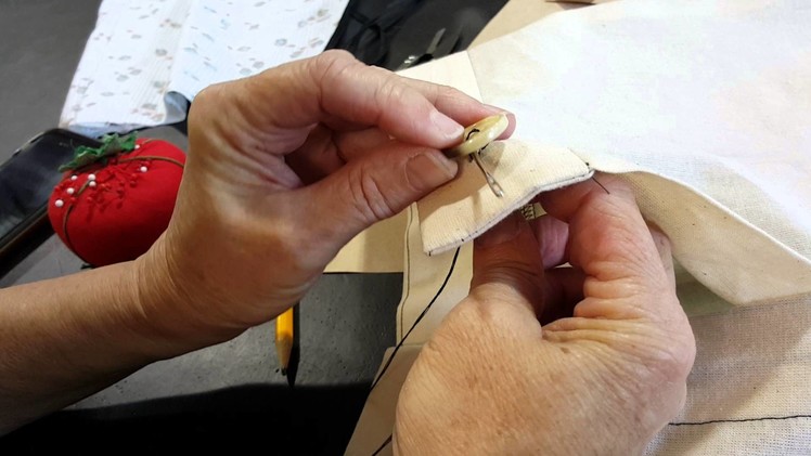 Handsewing a button with a shank