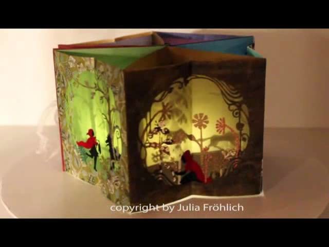Beautiful Pup-up carousel book ("Little Red Riding Hood") with a little light inside