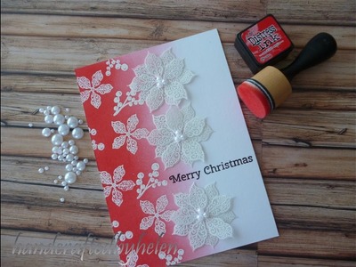 Emboss resist background with vellum poinsettias card