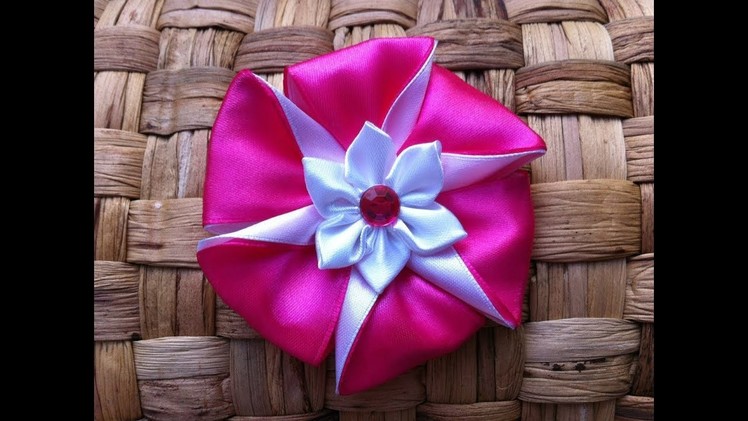 The decoration on the hairpin Kanzashi. Pink-white flower