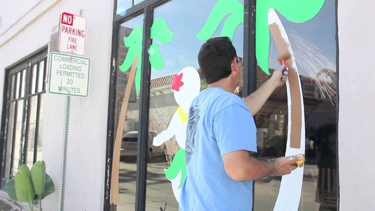 Dave Yant paints a Christmas window