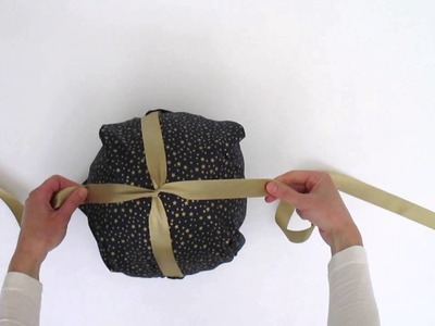 Gift Wrapping a football with Happywrap