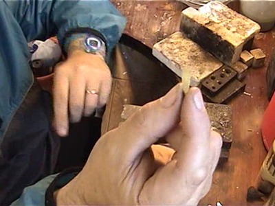 Goldsmith at work repairing jewellery video 3