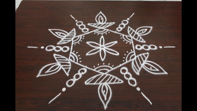 Rangoli designs for diwali with 7 to 4 interlaced dots- muggulu designs- simple kolam designs