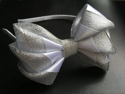 The decoration on the hairband Kanzashi. White - silver bow