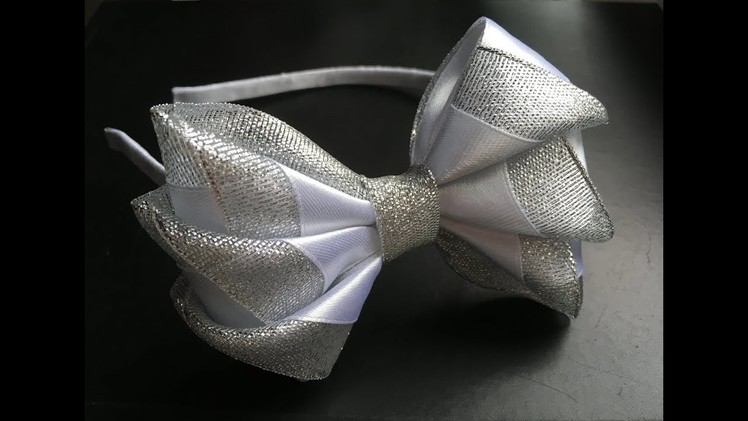 The decoration on the hairband Kanzashi. White - silver bow