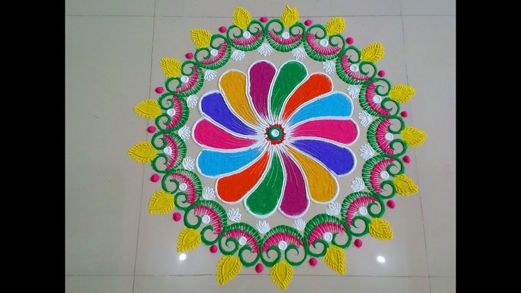 Big and beautiful multicolour rangoli design.