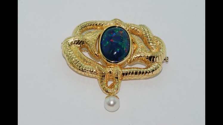 Black opal Handmade brooch 18kt gold with a black opal at the center