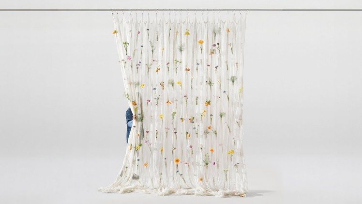 Fresh blooms decorate Draped Flowers Curtain woven from paper