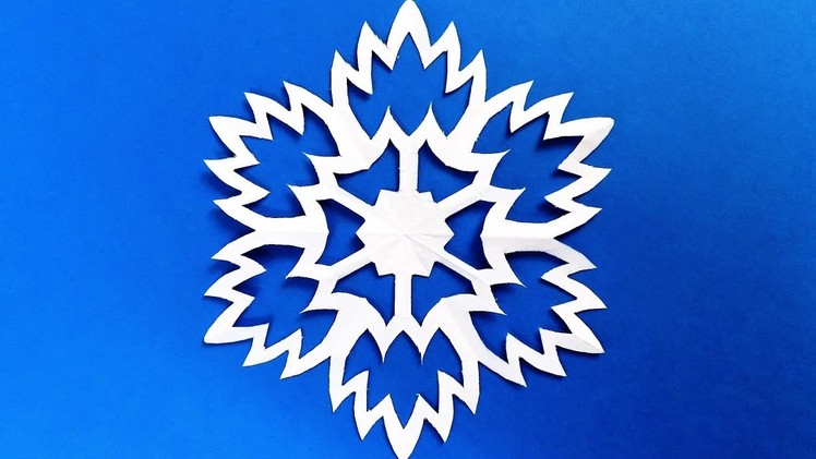 Paper snowflake tutorial. learn how to make snowflakes in 5 minutes