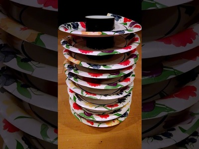 Spiral ball run track made from paper plates and a poster tube