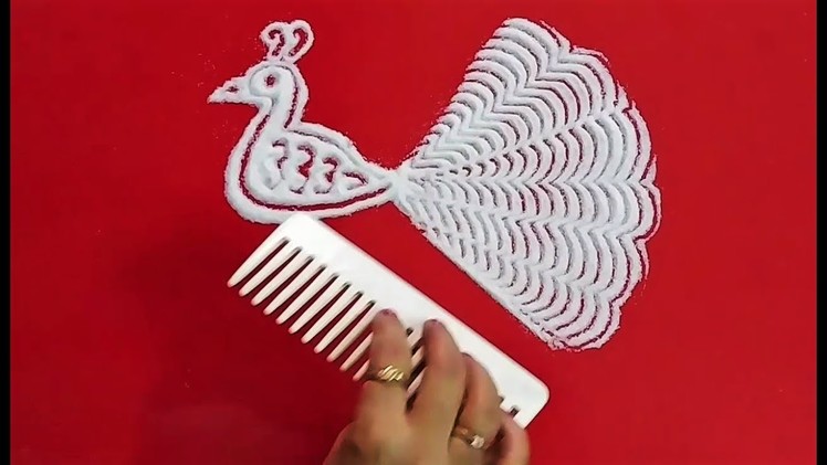 Easy peacock rangoli design using comb