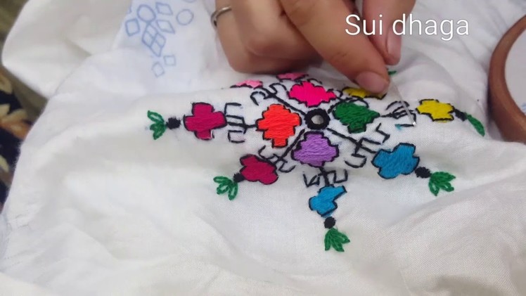 Hand embroidery: Balochi tanka. Balochi stitches motive with black outline. Gulesity embroidery