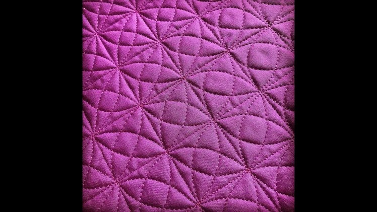 Kaleidoscope free-motion quilting in a grid!