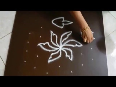 Simple flower kolam with 7 dots