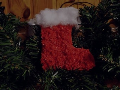 Christmas craft for kids.Santa's boot with coloured.colored rice
