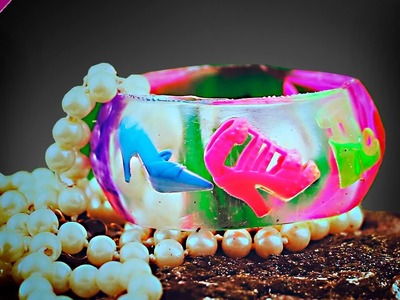 Epoxy.  Decoration from epoxy resin. Bracelet with shoes.  Filling transparent with dipit. Resin
