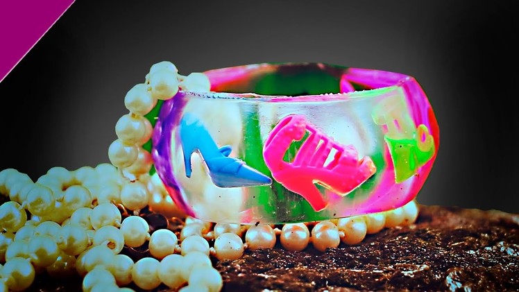 Epoxy.  Decoration from epoxy resin. Bracelet with shoes.  Filling transparent with dipit. Resin