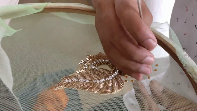 Boota work on a net fabric with Zardosi