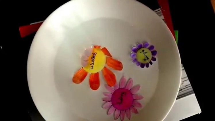 Blooming paper flowers in water