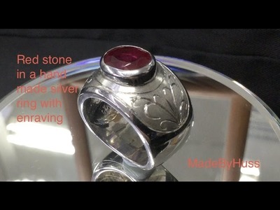 Red stone in a silver ring