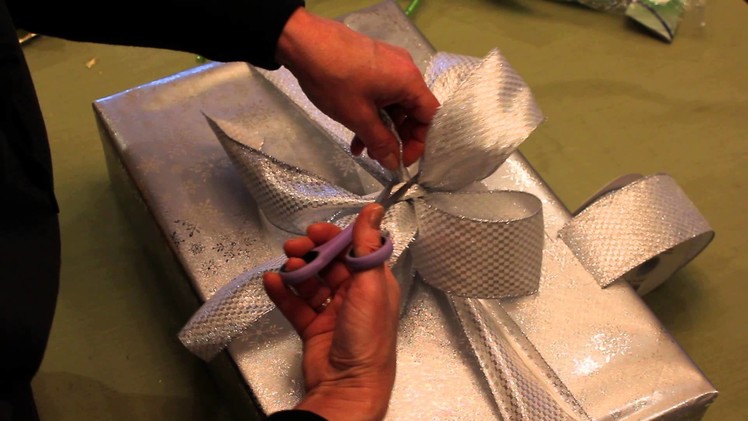 "How to Wrap A Gift" with ribbon and add a little extra something