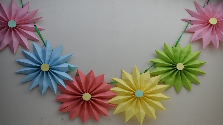 Christmas wall decor -  Diy paper Rosettes Garland for Christmas party Decoration on budget