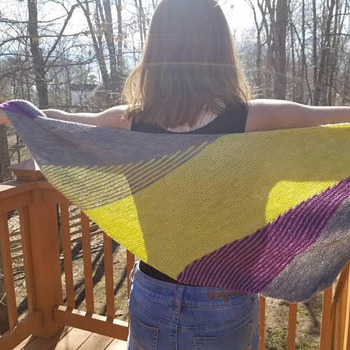 Gorgeous asymmetrical lightweight shawl made of a blend of merino wool, cashmere goat and nylon can be worn in a variety of ways.