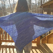 Lightweight knit shawl in a fingering weight merino wool using purple gradient to bring out the design. Gorgeous!