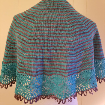 Lovely knit shawl made of fingering weight 90 percent fine Italian merino wool and 10 percent nylon in shades of teal and chocolate brown