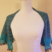 Lovely knit shawl made of fingering weight 90 percent fine Italian merino wool and 10 percent nylon in shades of teal and chocolate brown