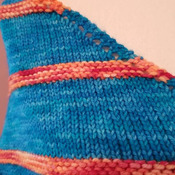 Bright and beautiful hand knit shawl of superwash merino wool