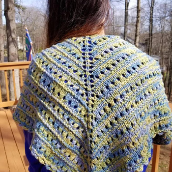 Lovely spring hand knit shawl in blue, green and yellow.
