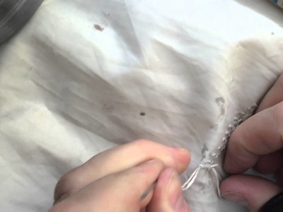 Hand Sewing a small tear in a Sail.