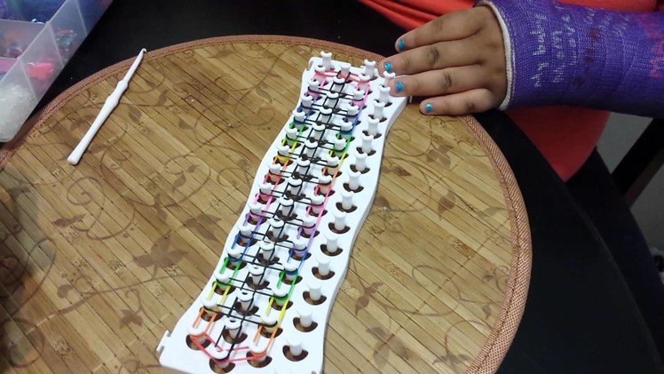 How to make a rainbow ladder bracelet on fun loom